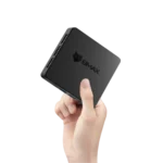 BMax B1 Mini PC màu đen đặt trên bàn làm việc, thể hiện thiết kế nhỏ gọn và hiện đại.