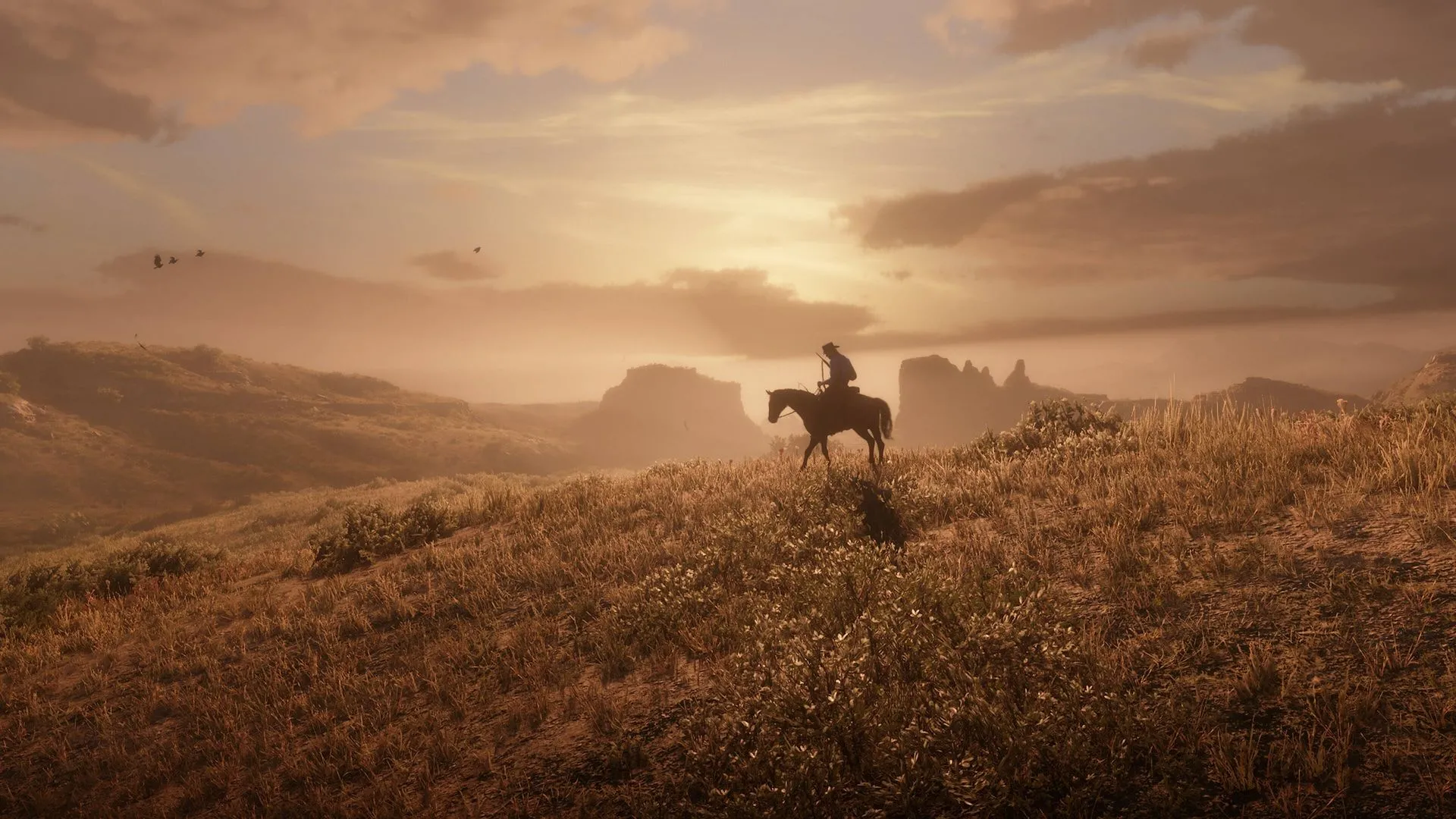 Cảnh hoàng hôn tuyệt đẹp trong game Red Dead Redemption 2, một trong những game AAA kinh điển trên Steam.