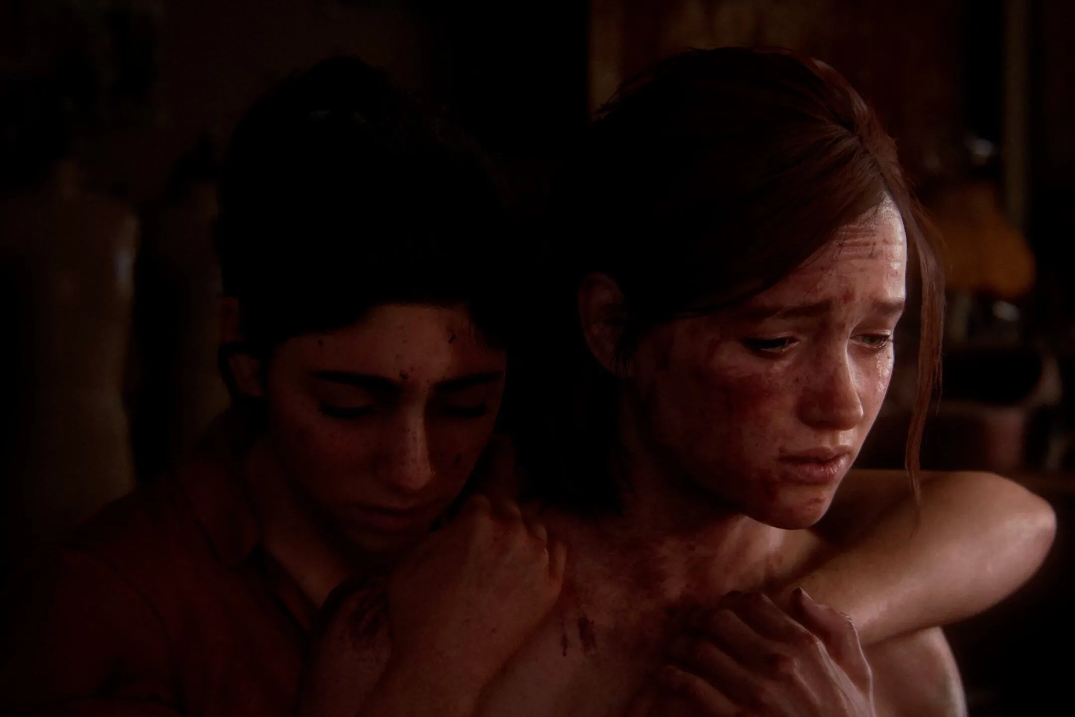 Ellie và Dina ôm nhau trong The Last of Us Part II, khắc họa mối quan hệ sâu sắc giữa hai nhân vật