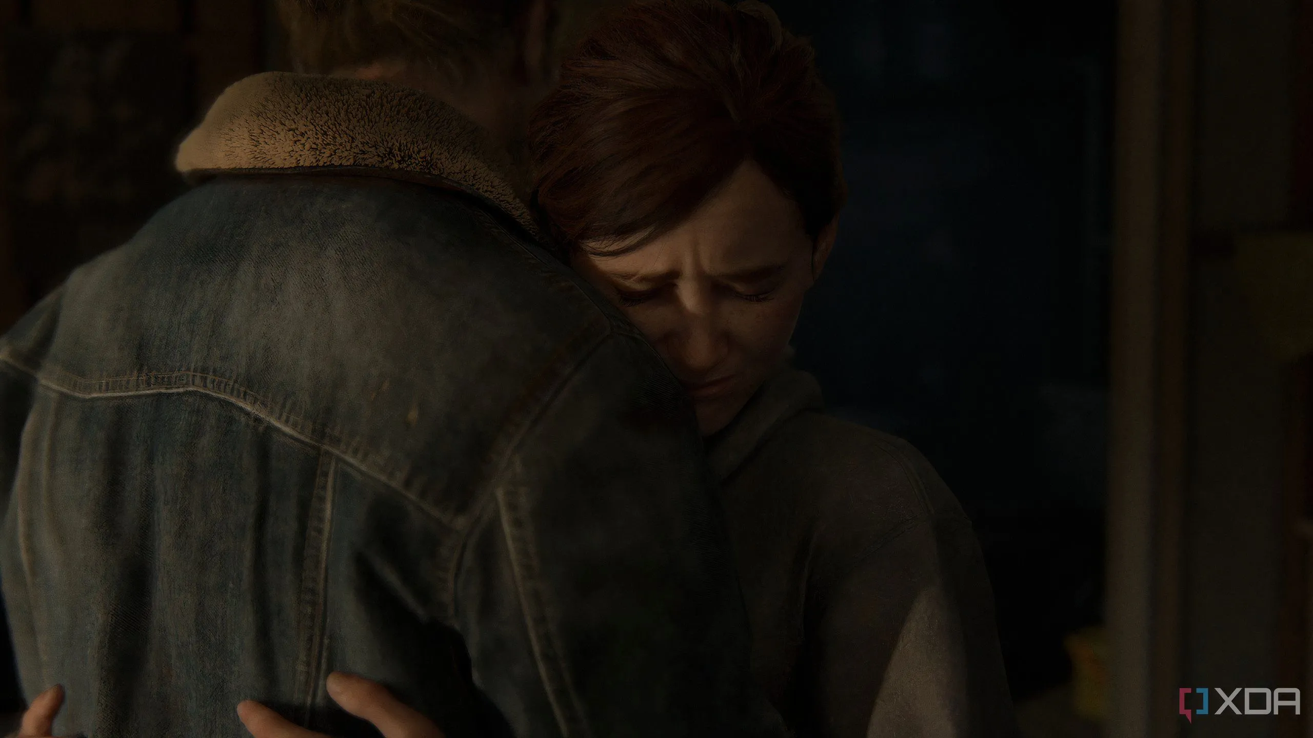 Ellie và Tommy ôm nhau trong cảnh game The Last of Us Part II Remastered trên PC.
