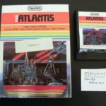 Hộp cartridge game Atlantis II hiếm cho hệ máy Atari 2600 với nhãn dán "Atlantis II" nhỏ, minh họa sự khó khăn trong việc phân biệt với bản gốc.