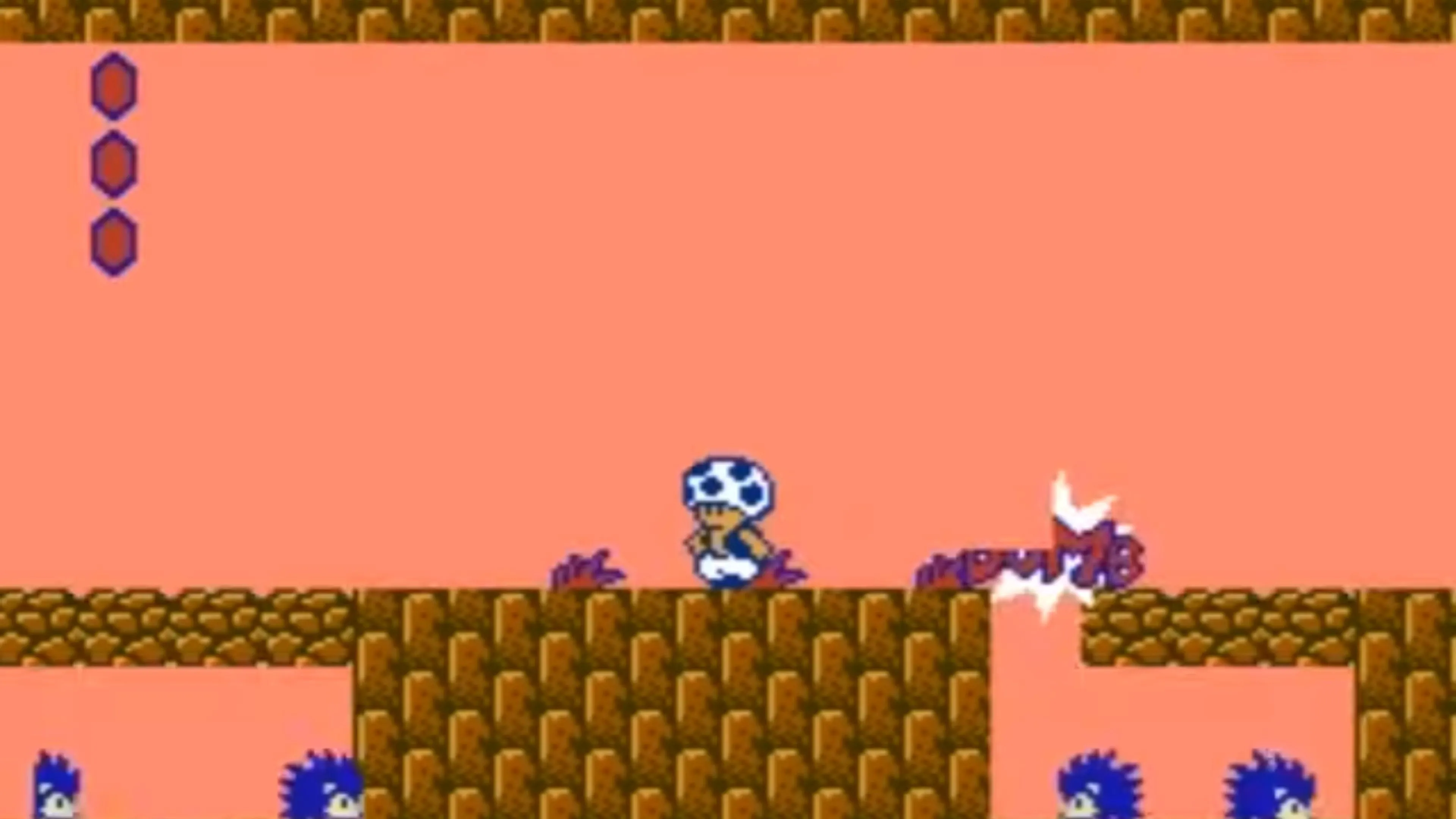 Mario né tránh chướng ngại vật trong màn chơi khó của Super Mario Bros. 2