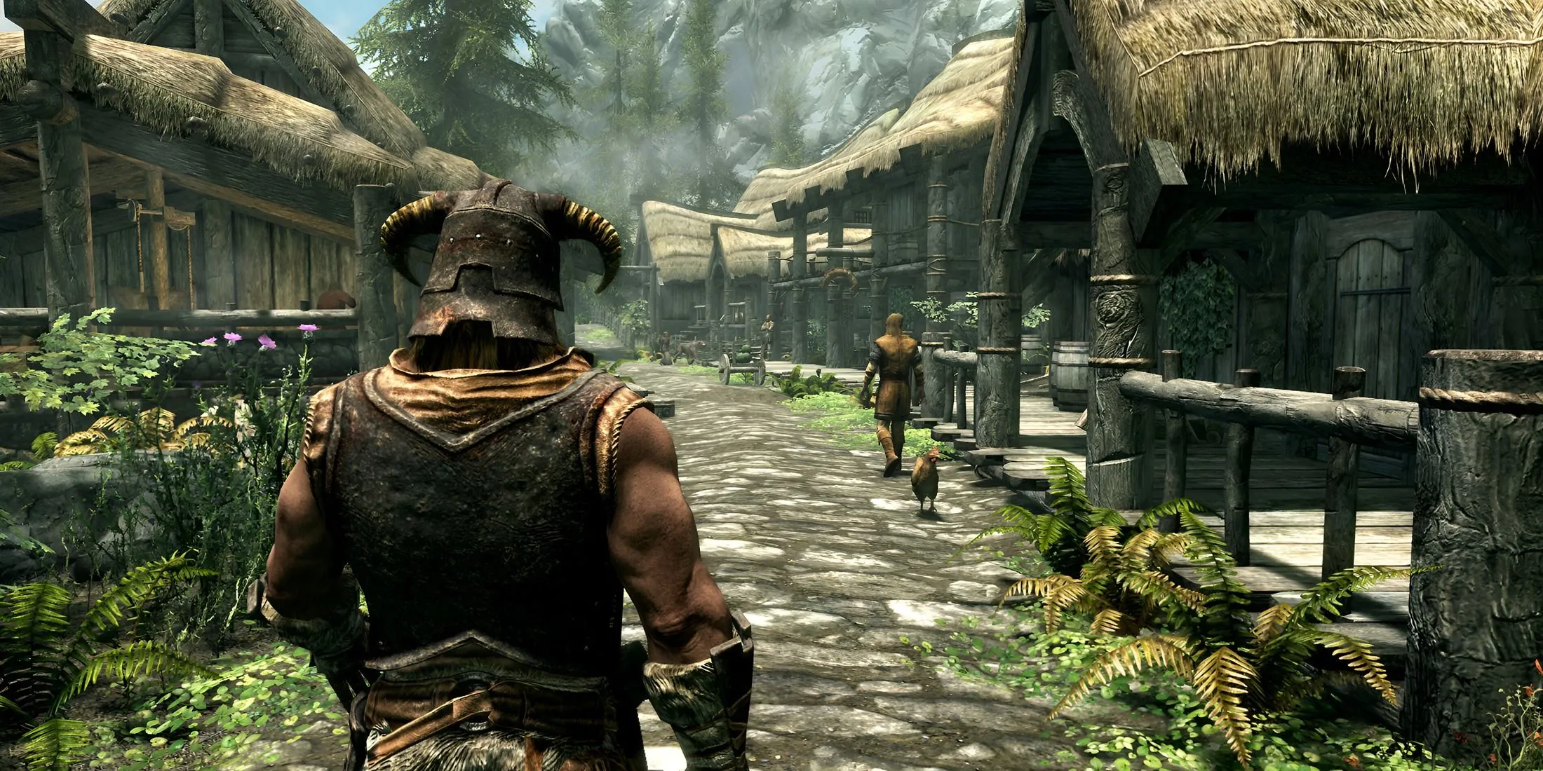 Nhân vật Dragonborn trong Skyrim đang đi qua một ngôi làng